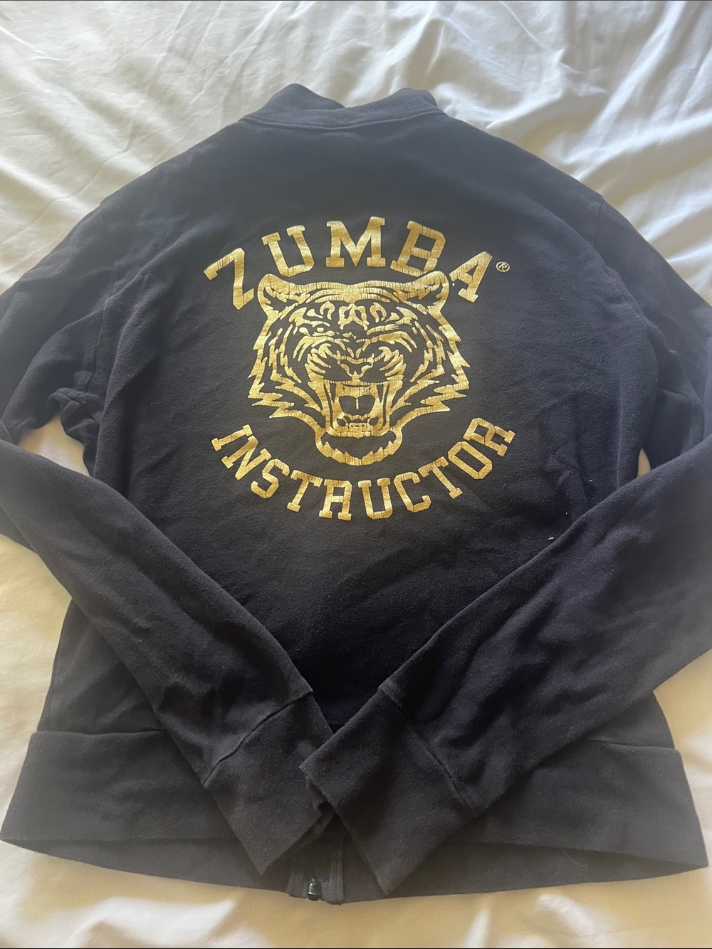 Zumba Fitness Black Zip-Up Sweater with Gold Tiger Logo